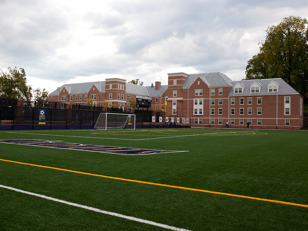 The front of the building from the other side of the soccer course