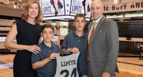 Joining new GW associate vice president and athletic director Michael Lipitz (r) are from left: his wife, Kerry, and sons Charlie and Henry. (William Atkins/GW Today)